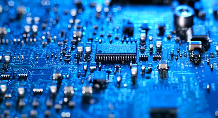 A close up of a blue circuit board.