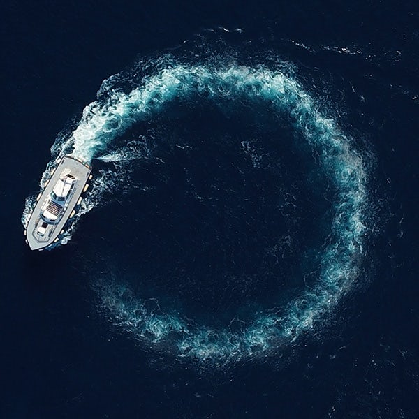 An aerial view of a boat in the ocean.