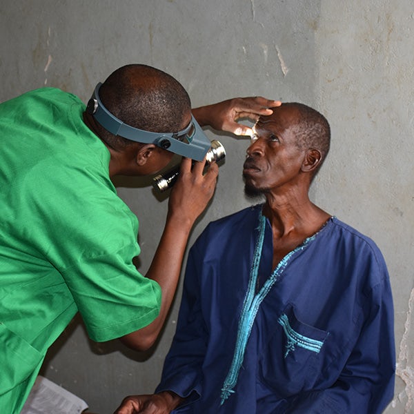 A man is being examined by a doctor.