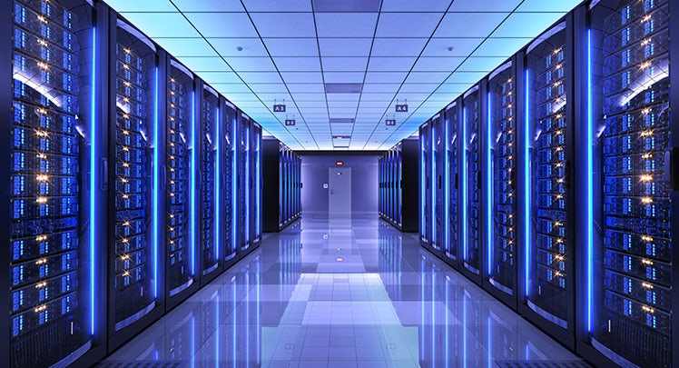 An image of a server room with blue lights.