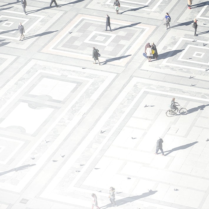 An aerial view of people walking on a street.