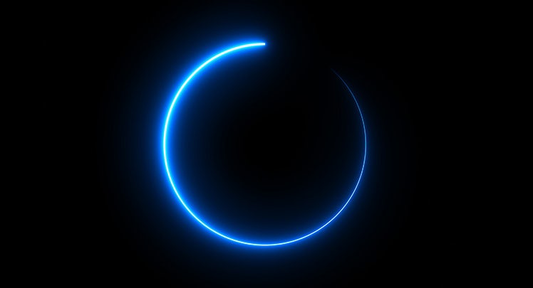 A blue glowing circle on a black background.