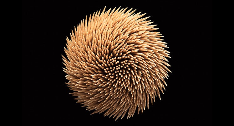A close up of a ball of toothpicks.