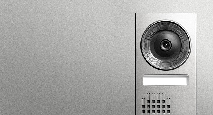 An image of a speaker on a wall.