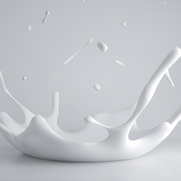 A white milk splash on a gray background.