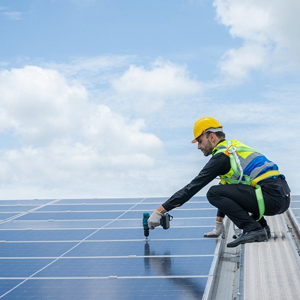 A man working on a solar panel.