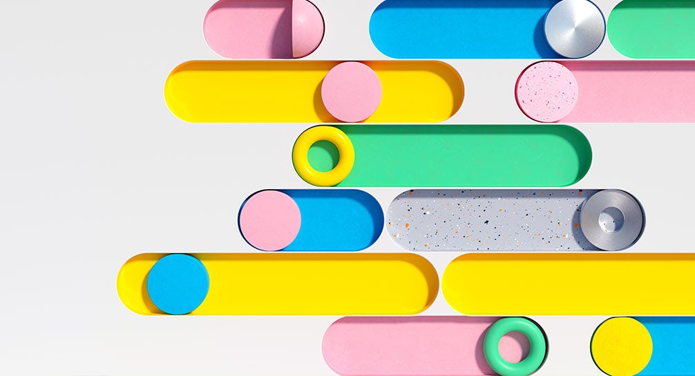A bunch of colorful paper tubes stacked on top of each other.