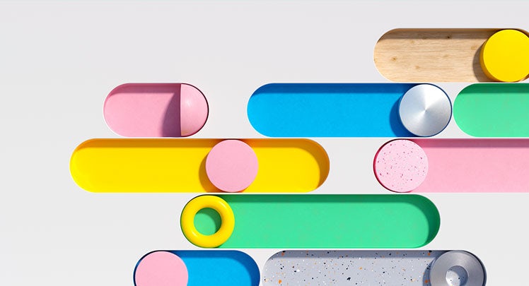 A group of colorful paper tubes stacked on top of each other.