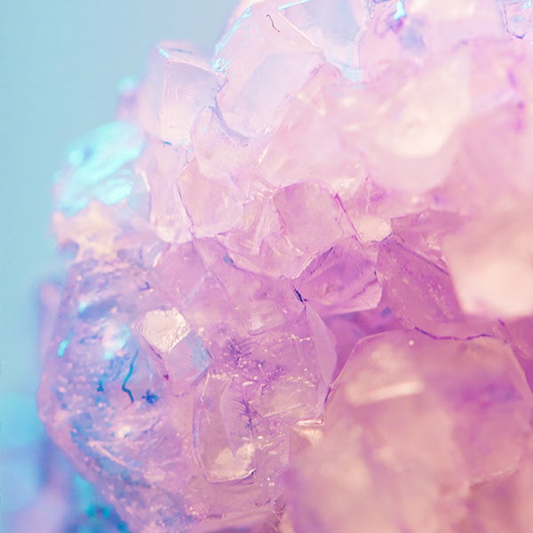 A close up of a pink and purple crystal.