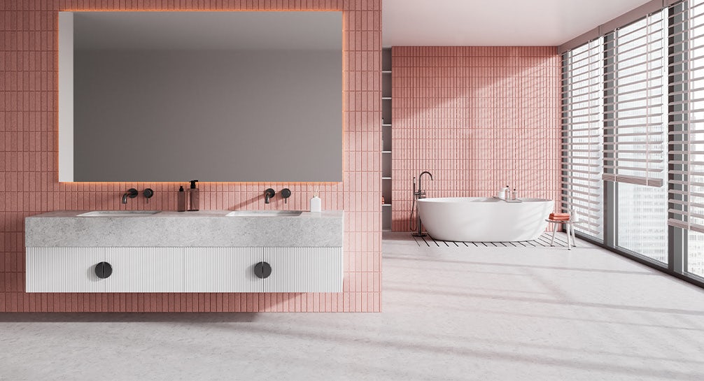 A bathroom with pink walls and a bathtub.
