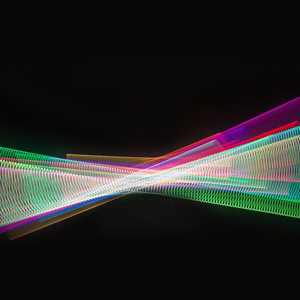 An image of a colorful light wave on a black background.
