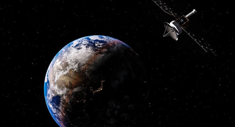 An artist's rendering of a spacecraft flying over the earth.
