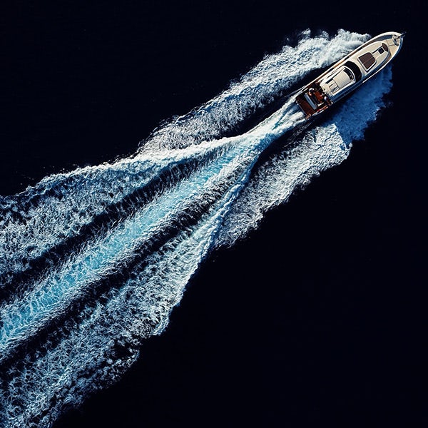 An aerial view of a motor boat in the water.