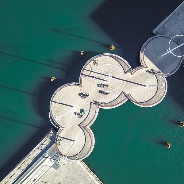 An aerial view of a circular pier in the water.