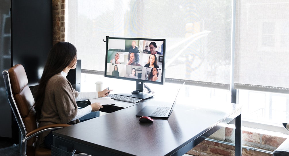 Woman meets with colleagues virtually 