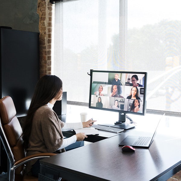 Woman meets with colleagues virtually