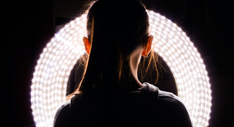 woman-in-front-of-round-light-unsplash-D1_KmrzNIlA-teaser
