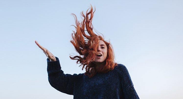 young-women-red-hair-freedom-sky-getty-1000370792-teaser
