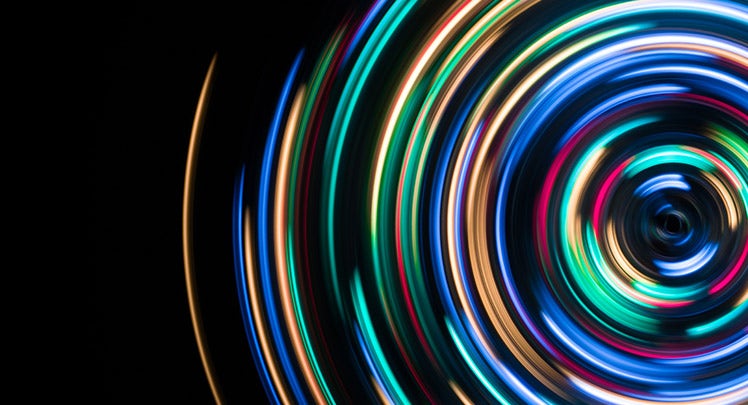 An image of a colorful light spiral on a black background.