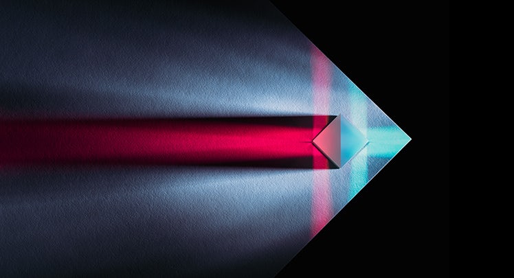 An image of a blue and red arrow in a dark background.