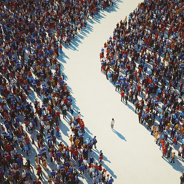 man-walking-in-crowds-of-people-getty-1443384686-square