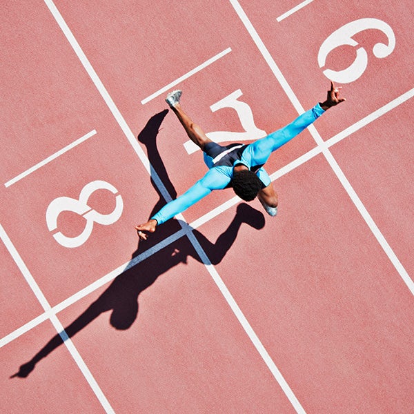 A man is running on a track.