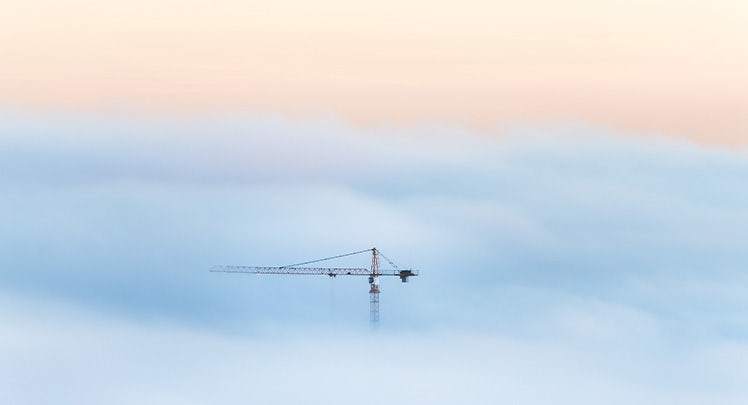 crane-in-a-sea-of-fog-getty-624917320-teaser